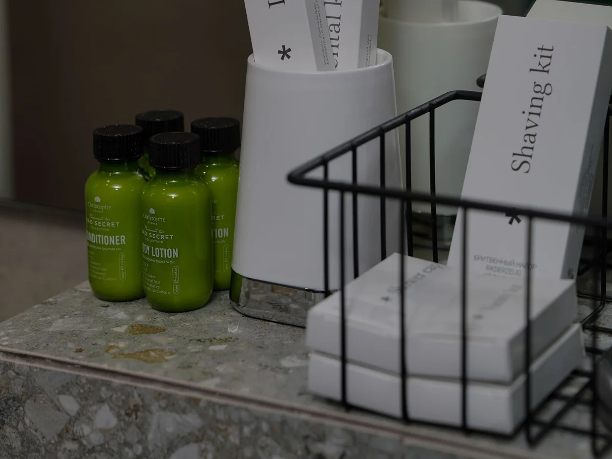 A guest bathroom arranged with clean towels and simple essentials