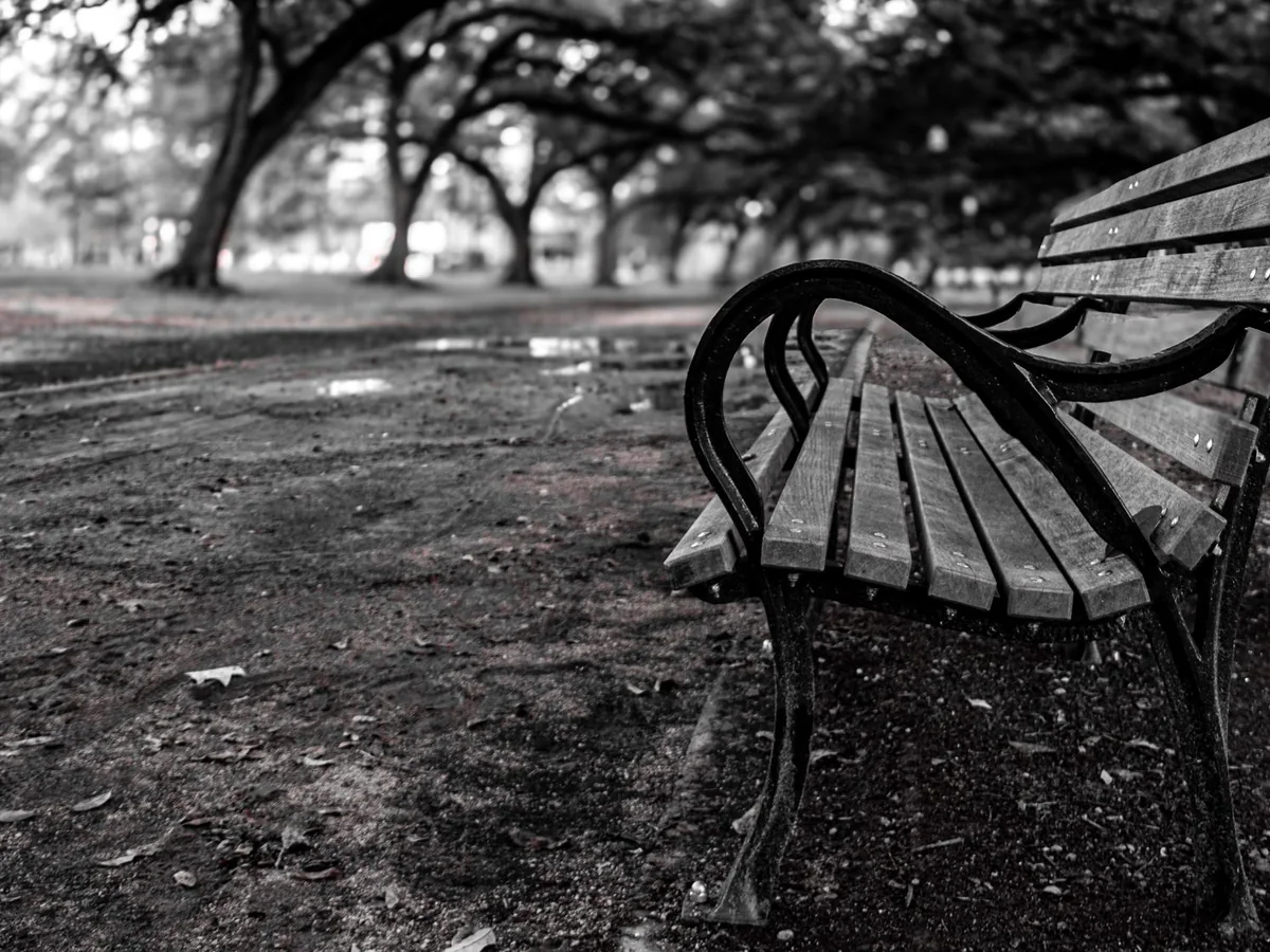 A weather-ready bench on a covered porch in a rainy climate
