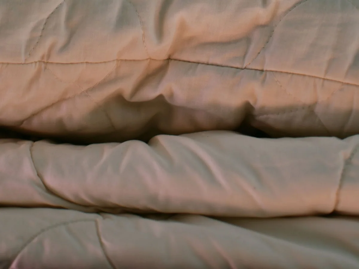 A neutral sofa refreshed with warm fall pillows and a throw