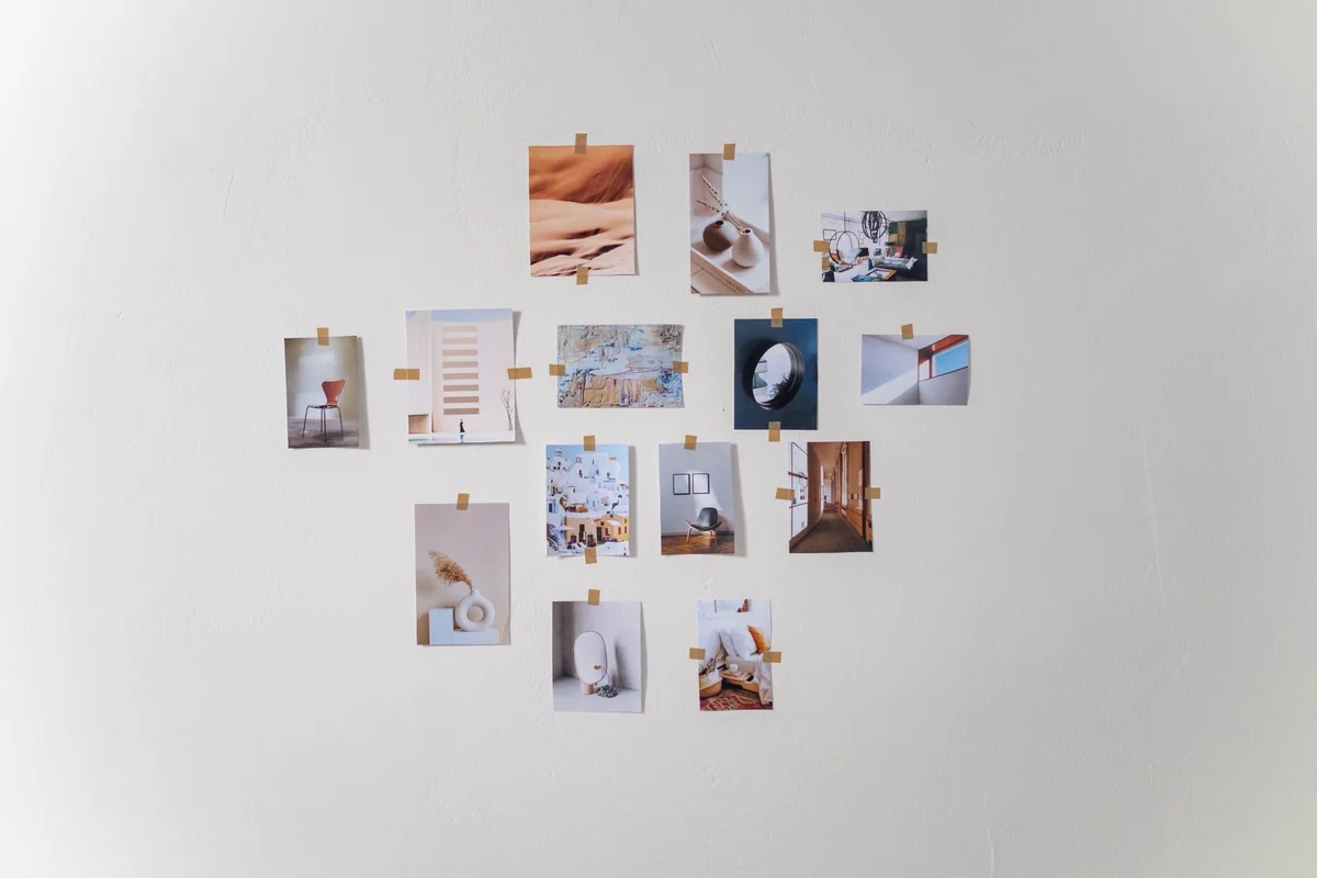 Prints displayed on a picture ledge without wall hooks