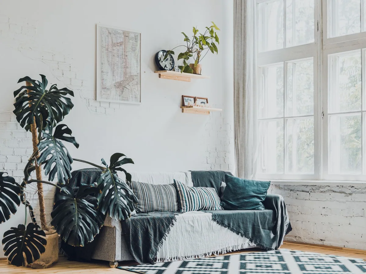 Large art leaning on a console in a rented apartment