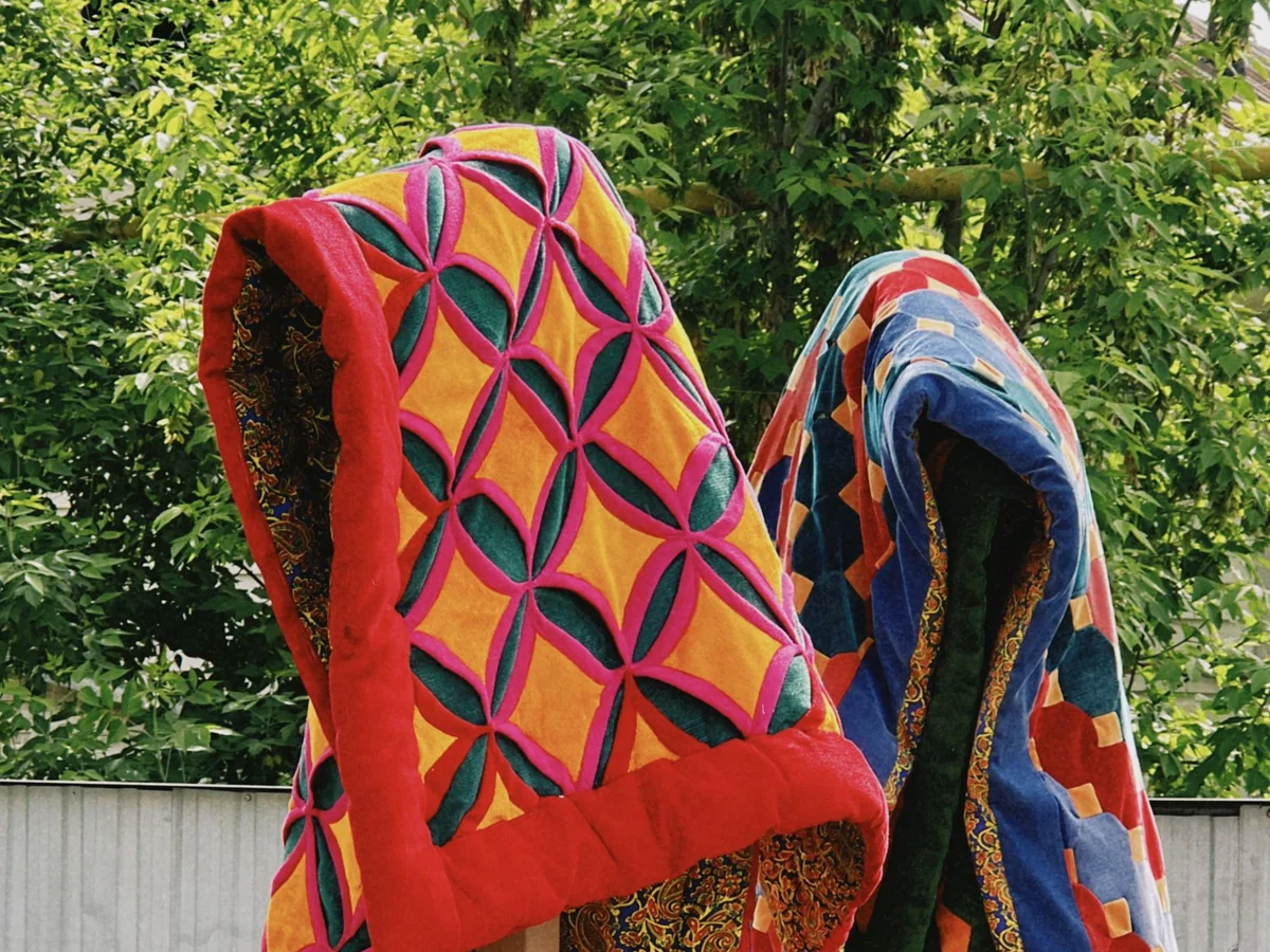 A neat washable quilt on a guest room bed