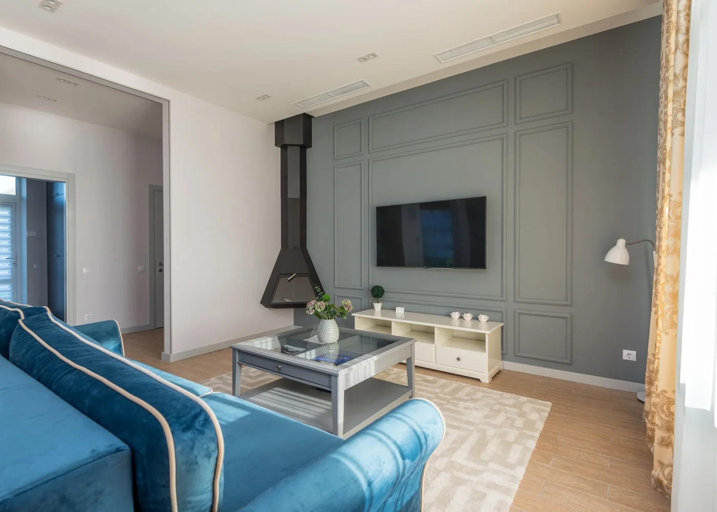 Layered neutral textiles and natural materials in a calm living space